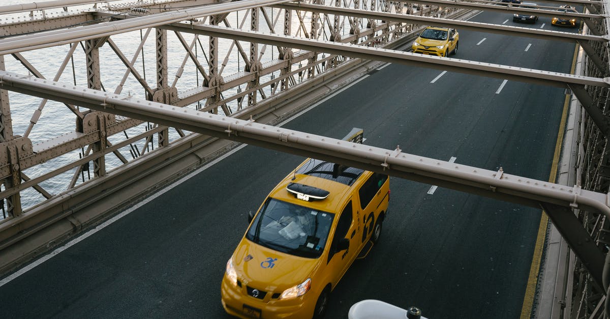 Signal directing on lanes - Taxi cabs driving on suspension bridge