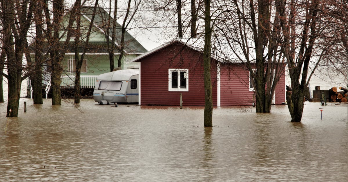 SMAC: Should I initiate flooding? - Red and White Wooden House Near Body of Water