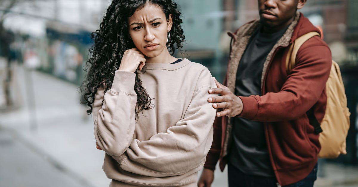 Stress recovery in town without abbey or tavern - Multiracial couple arguing with each other in street