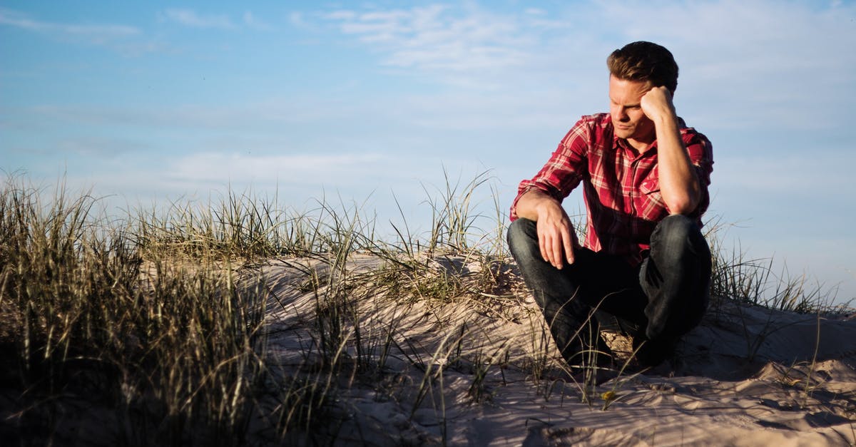 Stuck on a think different questions - Shallow Focus Photography of Man Wearing Red Polo Shirt