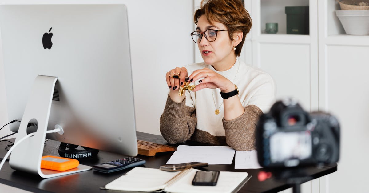 Super Mario Maker: Course Comments - Confident elegant lady in eyeglasses hosting webinar