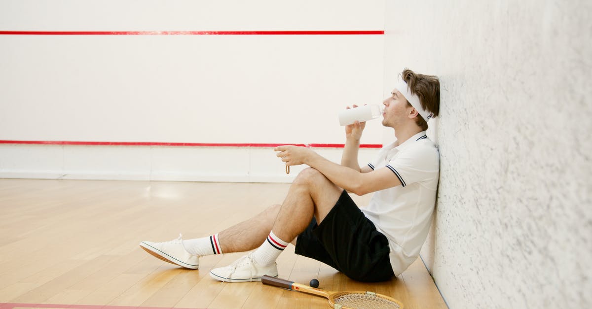 Test if a player has drank a water bottle? - Side View of a Squash Player Drinking Water while Resting