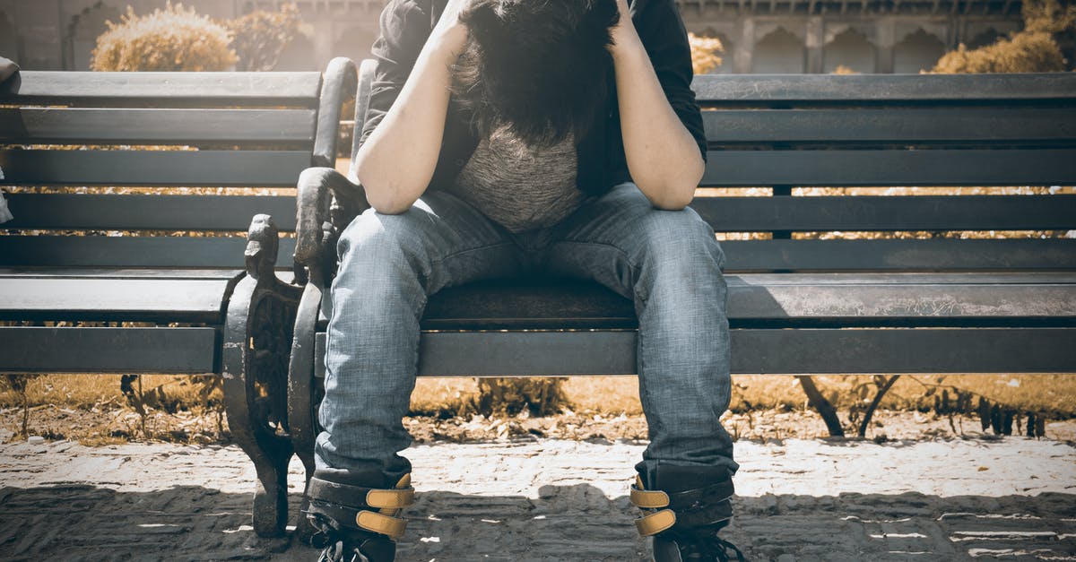 Trouble Spawning Plantera - Man in Black Shirt and Gray Denim Pants Sitting on Gray Padded Bench