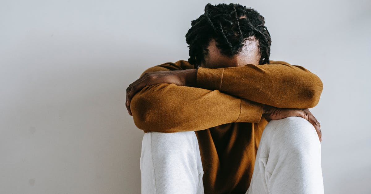 Trouble with mouse sensitivity lagging on older version of Minecraft - Unrecognizable hopeless African American male in casual outfit with dreadlocks sitting leaned on hands in daylight