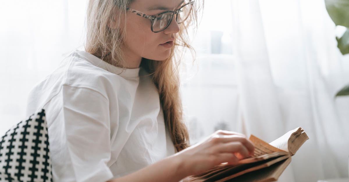 Turn off steam logon requirment for LAN CSGO - Focused woman flipping page of book