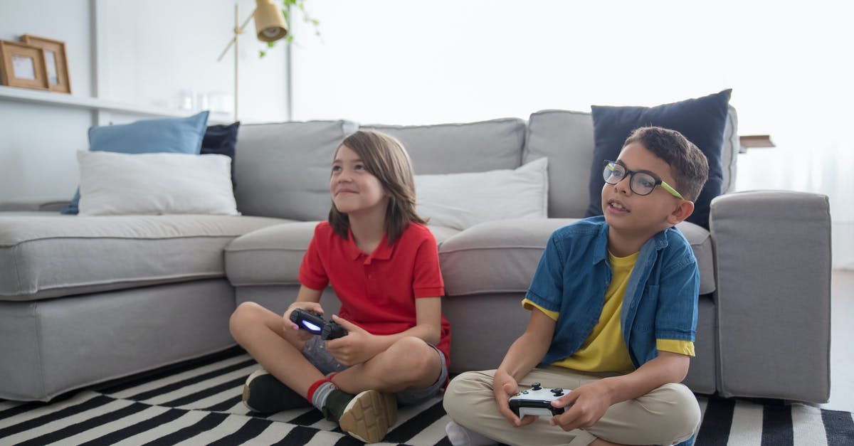 Using Cloud Saved Games for Non-Backwards Compatible games - Two Young Boys Sitting on Striped Rug