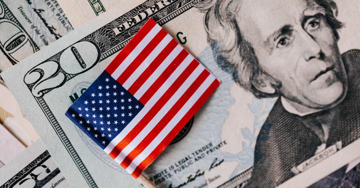 Valve Basestations 2.0 not properly working with SteamVR - From above of small American flag placed on stack of 20 dollar bills as national currency for business financial operations