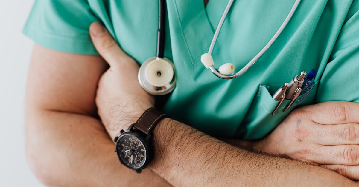 Vessels escaping host bodies over time - Crop doctor with stethoscope in hospital