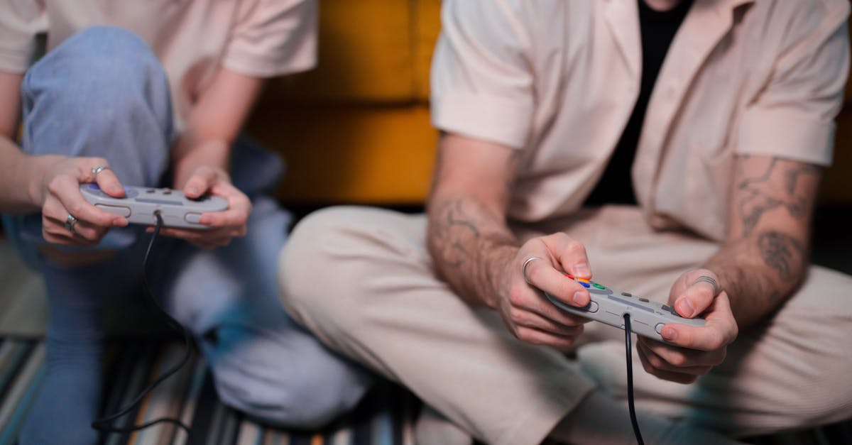 Video Options Not Saving - Man in White Button Up Shirt Holding White Smartphone