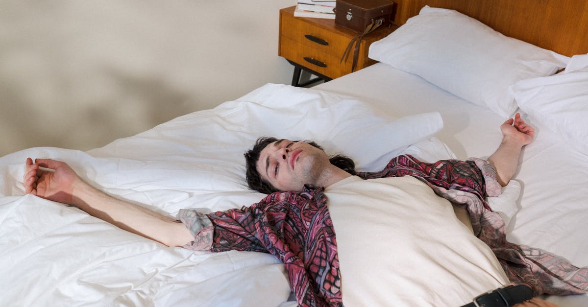 Wages maxed out at $25 - Young Man Laying on Back in Bed and Chilling Out