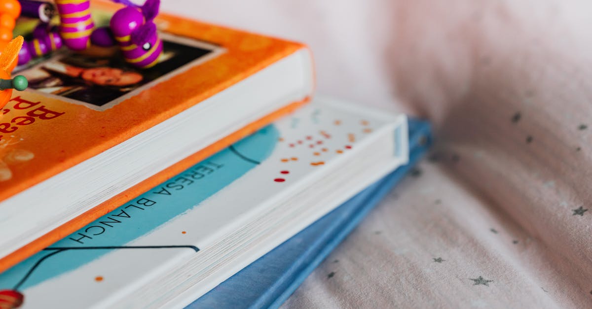 What's that number near some player's name? - Close-up of a Pile of Books