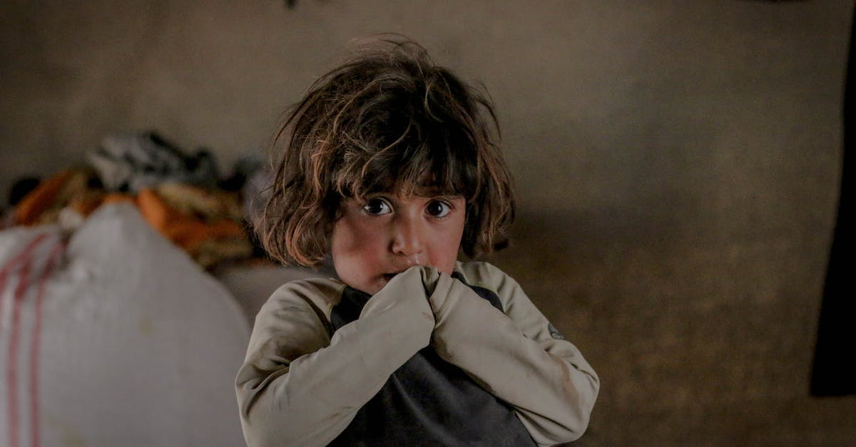 What's the benefit of destroying abandoned dwellings? - Scared kid looking at camera