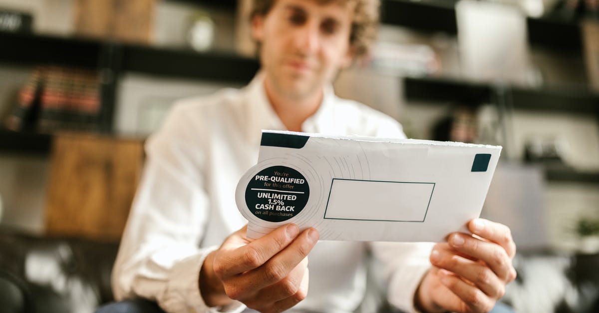 What's the benefit of provoking war? - Man in White Dress Shirt Holding White Envelope