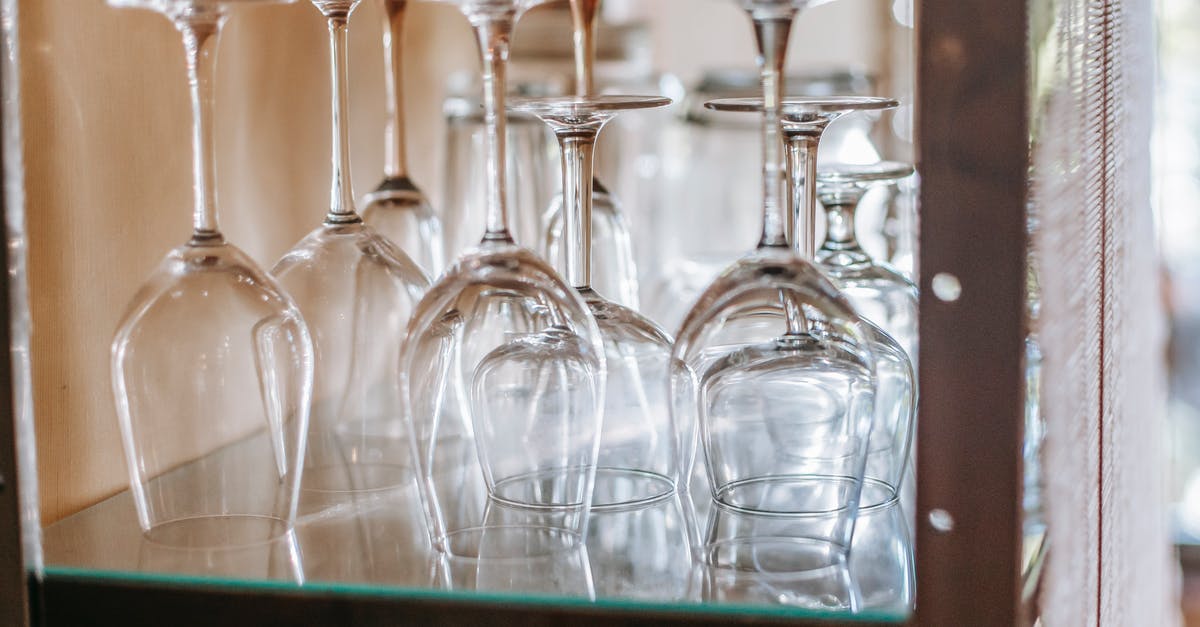 What addon or setting provides this cooldown bar - Many wineglasses placed upside down on glass shelf in cupboard in light modern restaurant