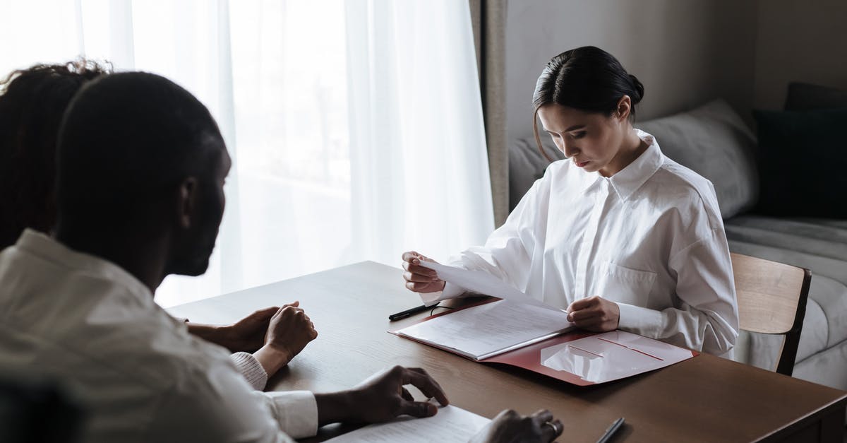 What are the benefits of being social? - Man in White Dress Shirt Sitting on Brown Wooden Table