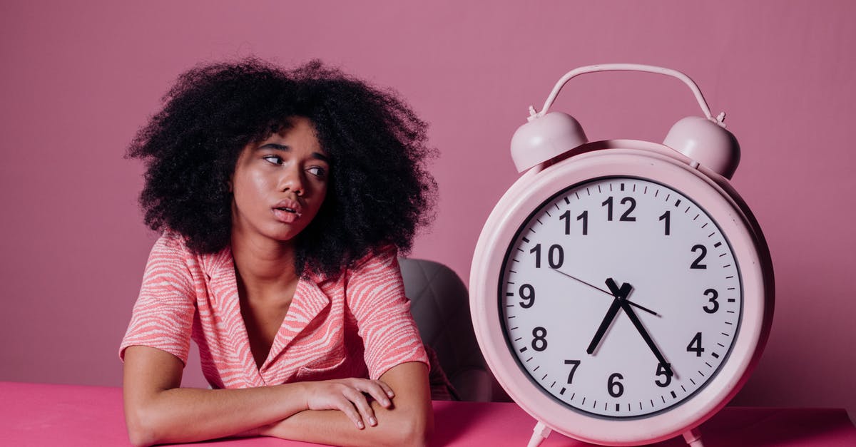 What are the benefits of waiting to drop troops second? - Woman Looking at a Big Pink Alarm Clock