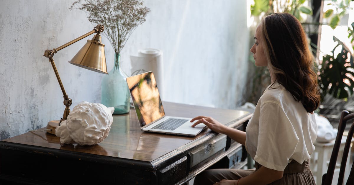 What are the common sub-categories of computer RPG? - Woman in White Shirt Sitting on Chair Using Macbook