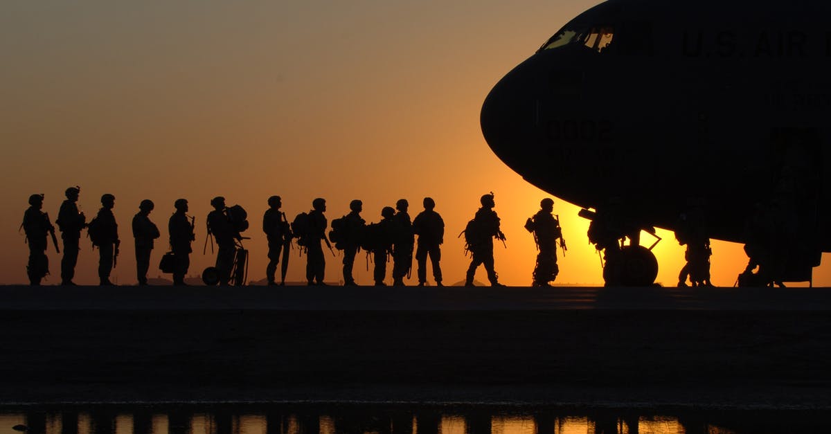 What becomes a coalition after winning a war against it? - Soldiers in Line to Get in a Plane