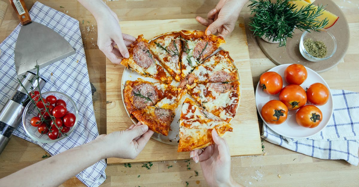 What body parts did the Remnants of Despair take from Junko Enoshima? - From above unrecognizable people taking slices of pizza with salami melted cheese and herbs from plate on kitchen table What body parts did the Remnants of Despair take from Junko Enoshima? - From above unrecognizable people taking slices of pizza with salami melted cheese and herbs from plate on kitchen table