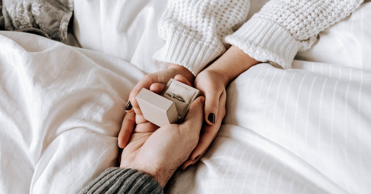 What bonuses do beds give in Survival mode? - Crop faceless man making proposal and presenting ring to girlfriend