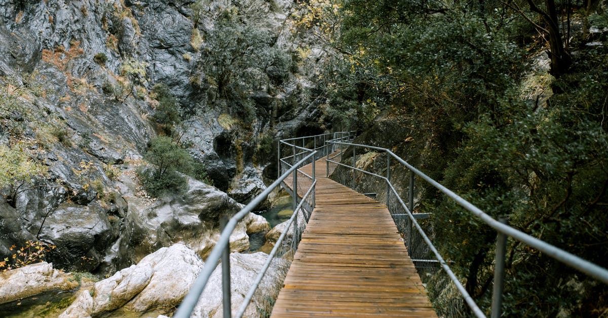 What carries over into ng+? - Small footbridge over river in mountainous terrain