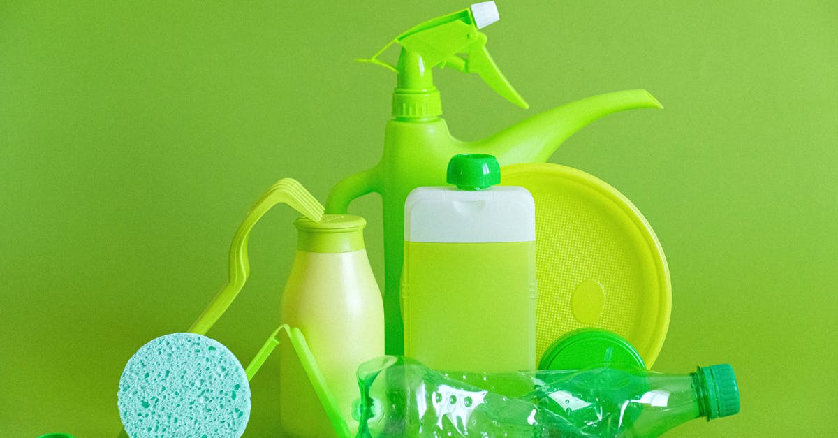 What causes ecological damage in Alpha Centauri (Alien Crossfire)? - Monochrome green bottles and containers for liquids or gel with plastic bottle and lids on green background