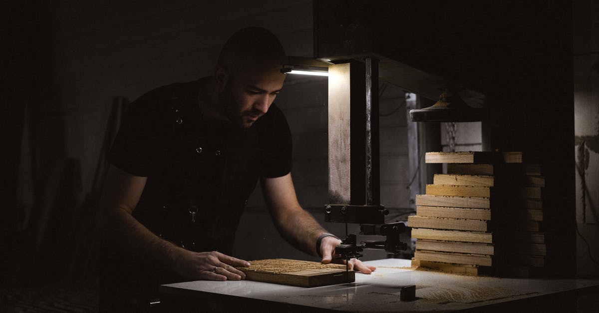 What created Dark Link, and what is his purpose? - Focused craftsman carving wooden board