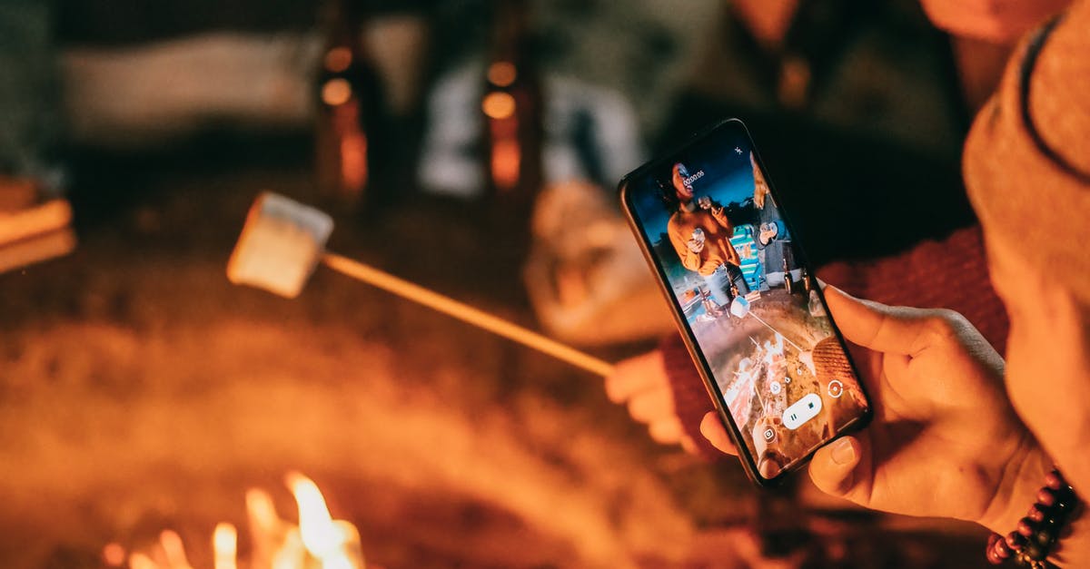 What determines the difficulty for capturing a tile? - Man Recording on His Smartphone Women Roasting Marshmallow