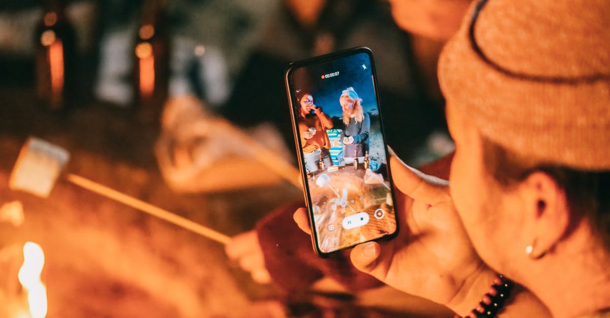 What determines the difficulty for capturing a tile? - Man Recording on His Smartphone Women Roasting Marshmallow