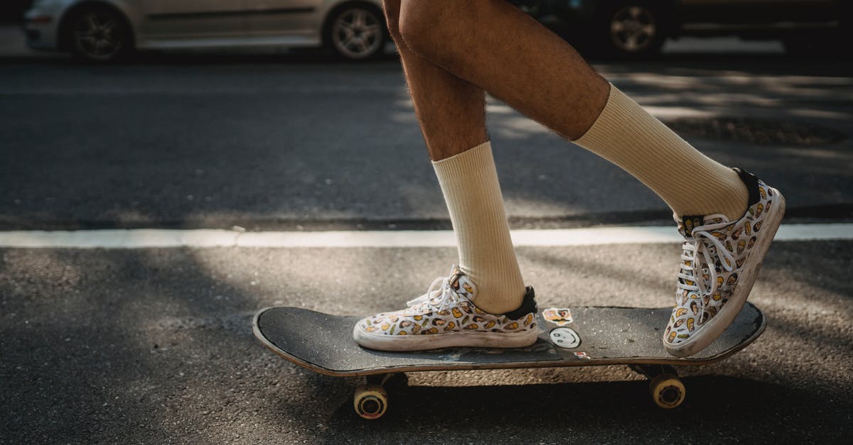 What determines the speed of a Soul Challenge? - Crop faceless skater riding skateboard on roadside