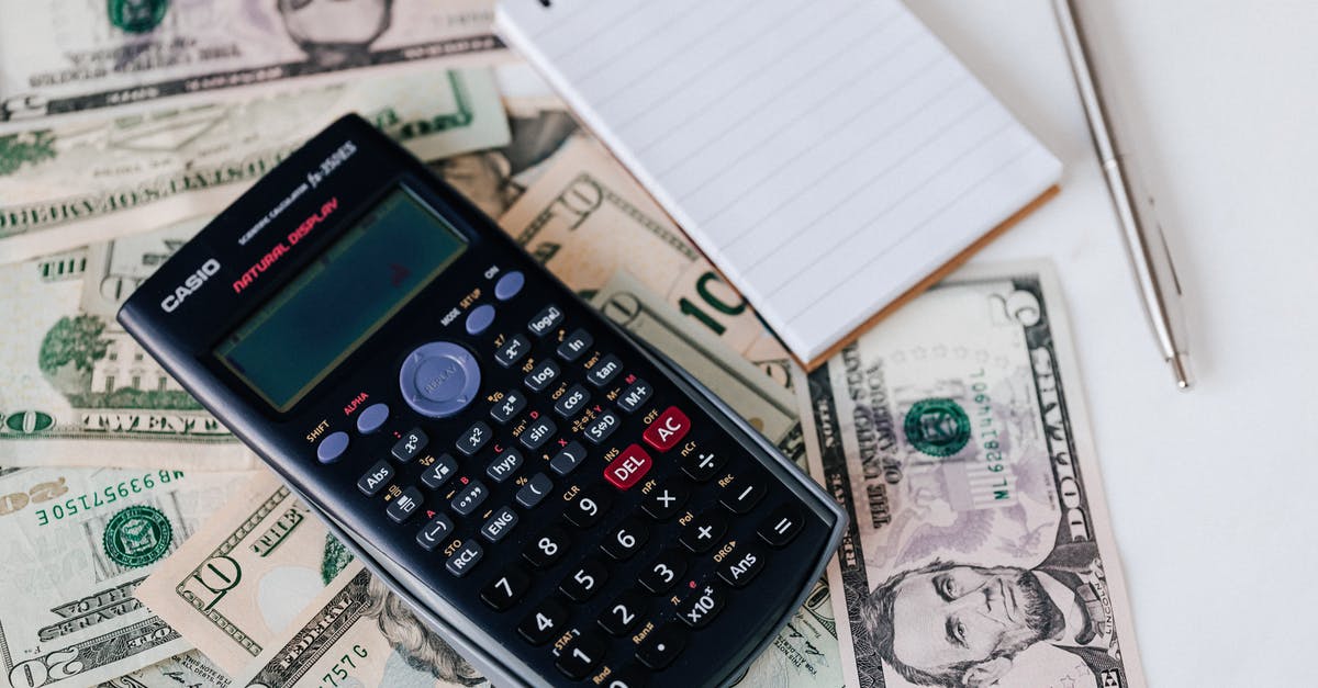 What do midget goliaths count as for Badass Rank? - From above electronic calculator and notepad placed over United States dollar bills together with metallic pen for budget planning and calculation