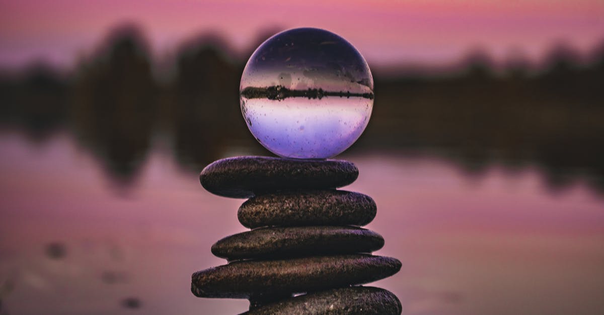 What do the circle of stones represent? - A Lensball on a Stack of Stones