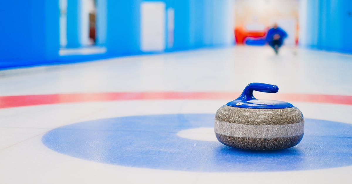 What do the circle of stones represent? - Curling stone placed in house on ice rink