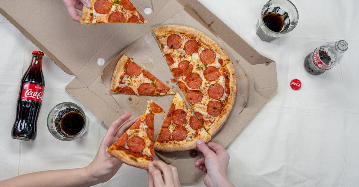 What does eating and drinking do? - Person Holding Pizza on White Box