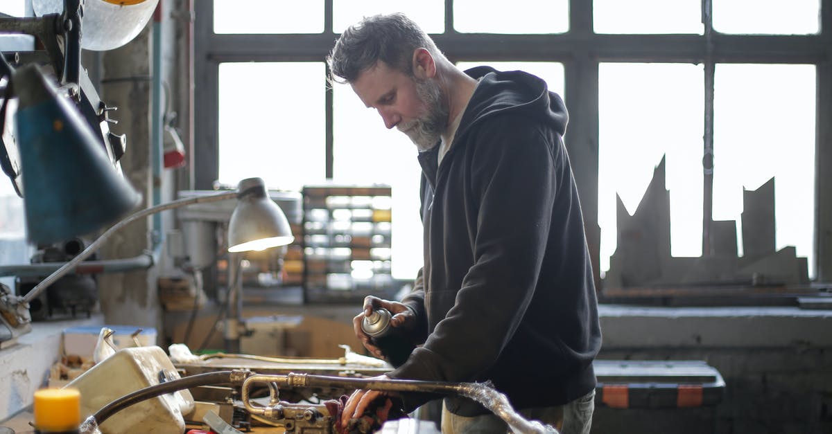 What does P.E.K.K.A stand for? - Serious bearded mechanic working at workbench in light workshop