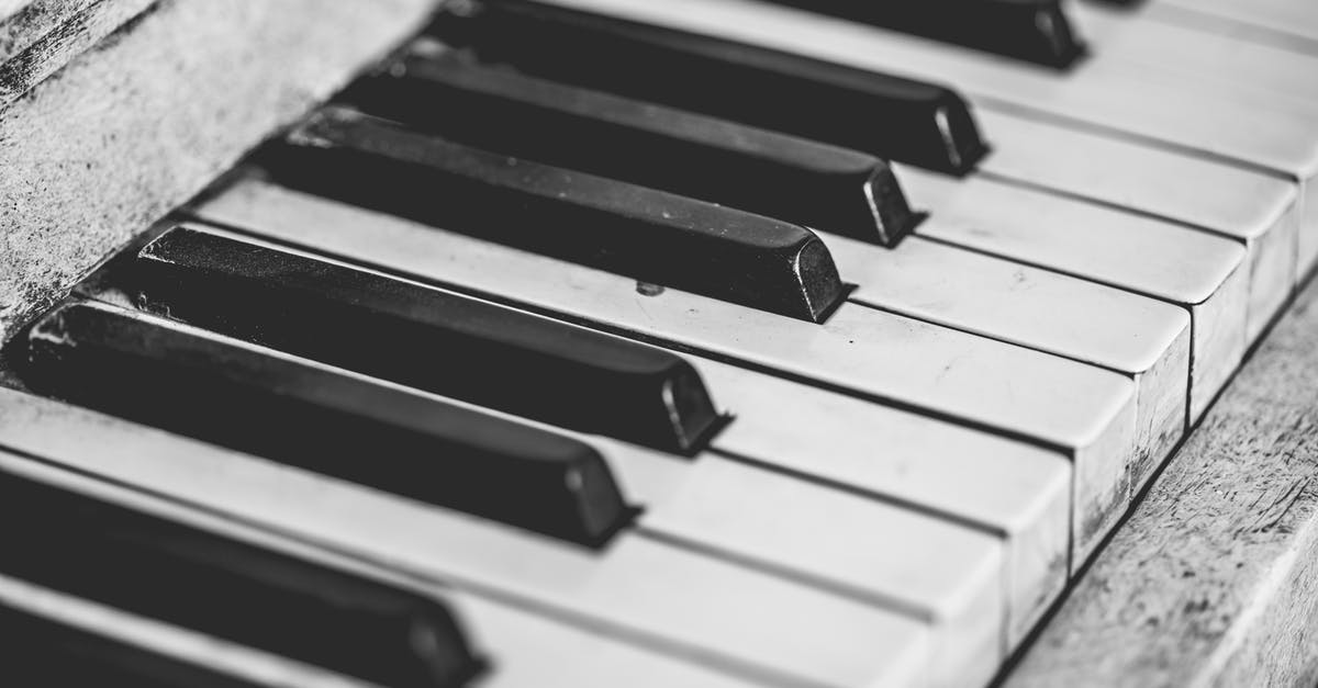 What does the FN key actually do? - Selective Focus Photography of Upright Piano