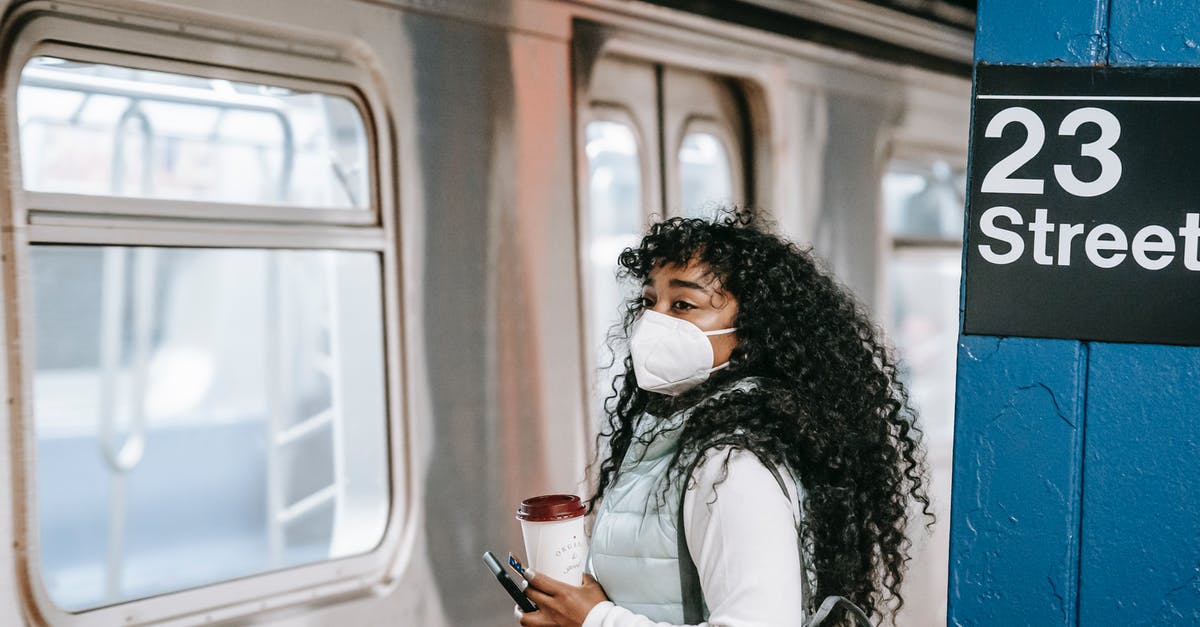 What does the gas mask protect against in Metro Exodus? - Black woman waiting for train on underground platform