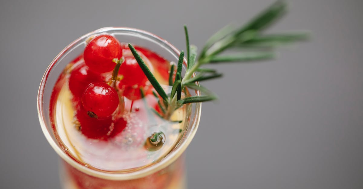What does the grey portion of the experience bar denote? - High angle of transparent glass filled with champagne served with fresh red currant and rosemary