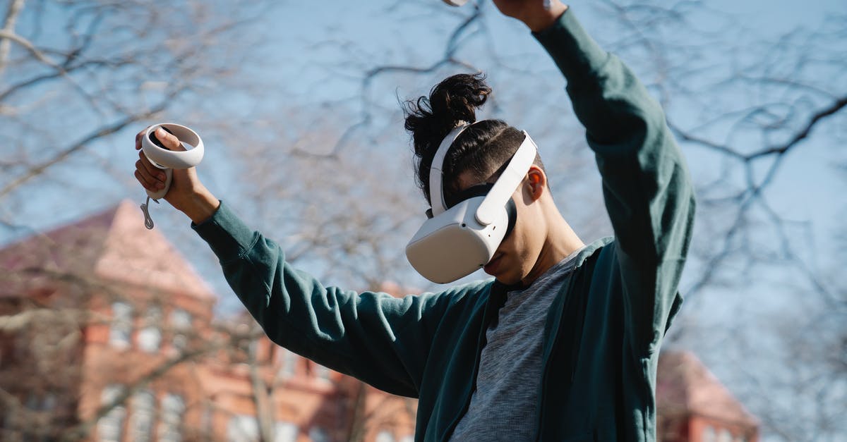 What game is this city screen from? - Man entertaining in VR headset in park