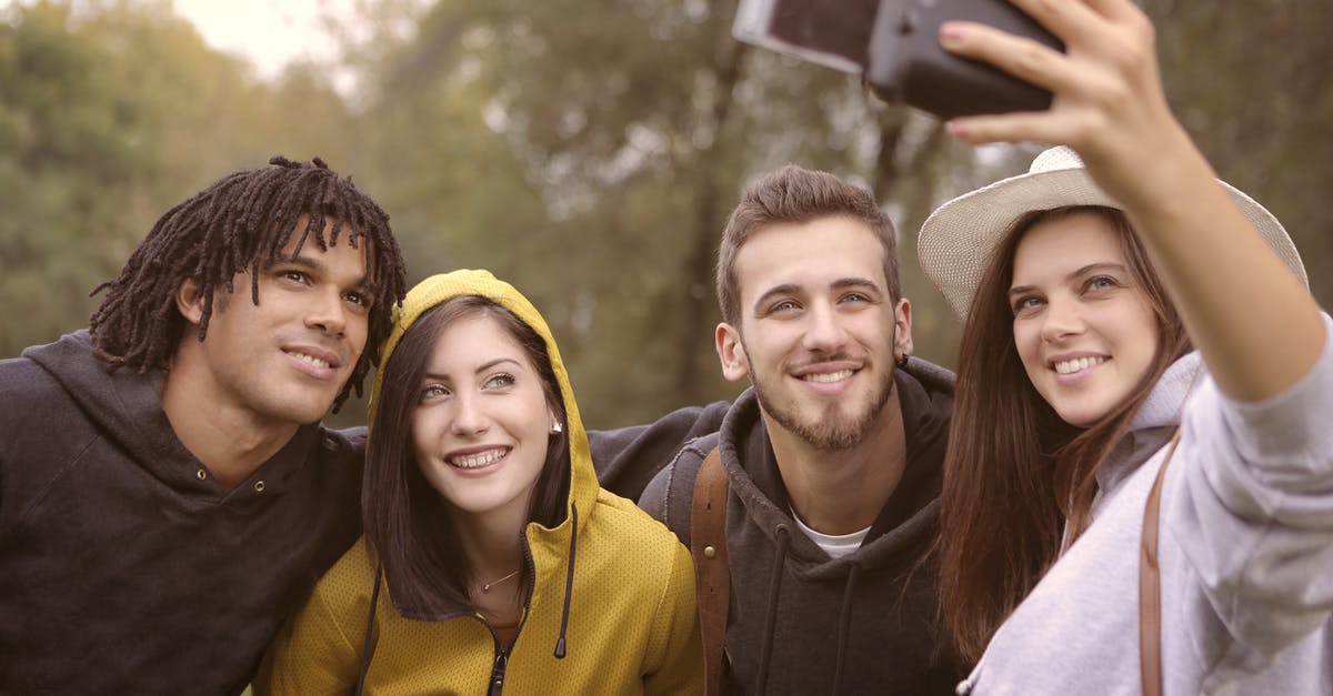 What happens if fewer than three team members are available? - Happy diverse friends taking selfie in park