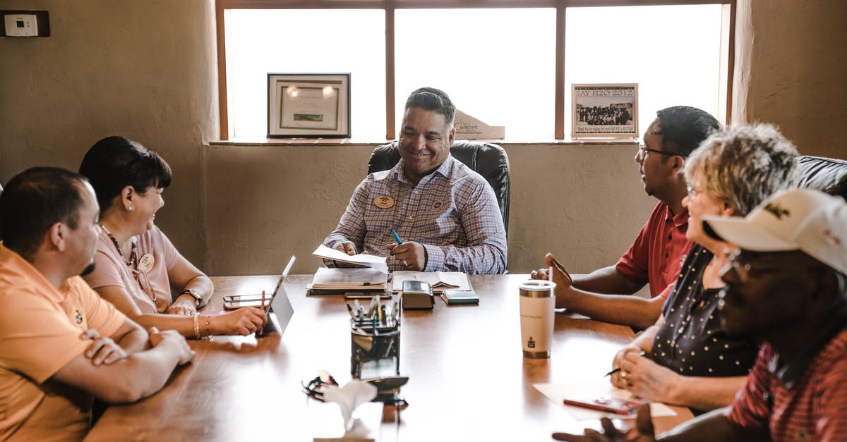 What happens if fewer than three team members are available? - People Sitting Around Wooden Table 