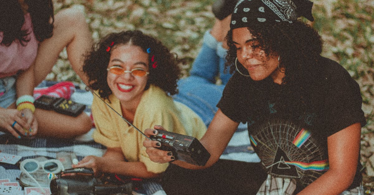 What happens if I lose all three hearts? - Shallow Focus Photo of Woman Holding Black Am/fm Radio