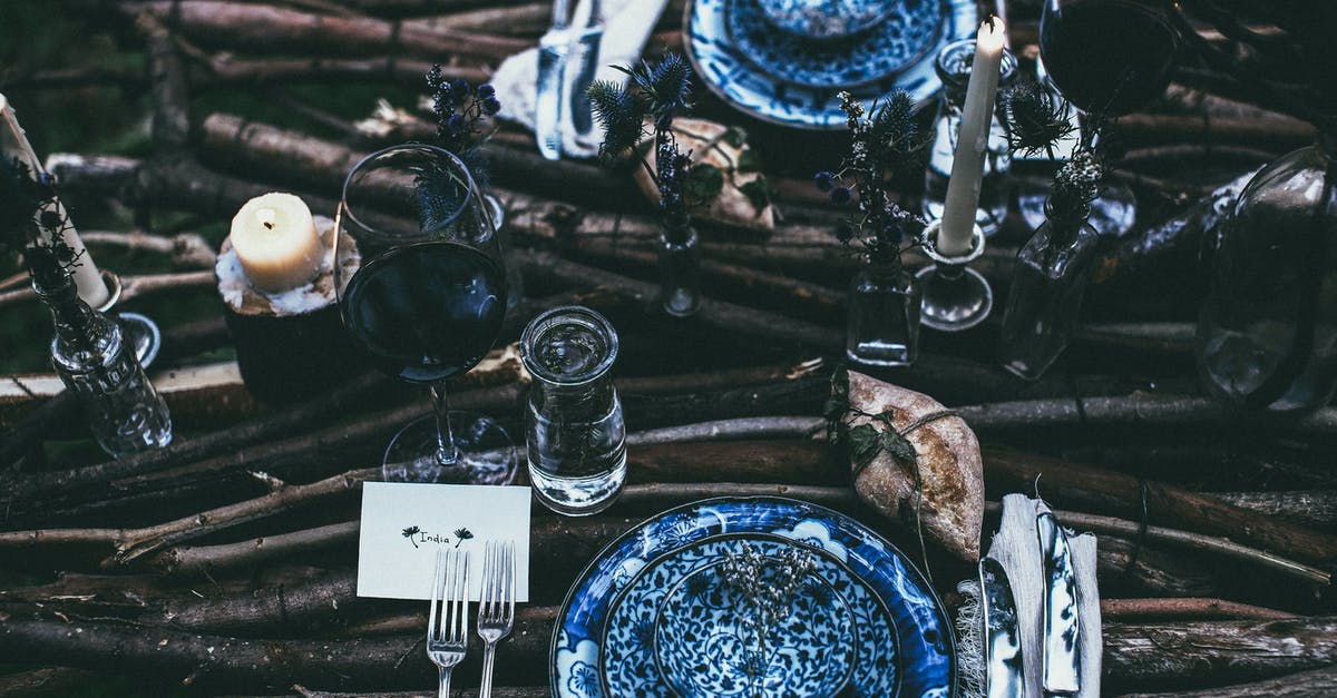 What happens to extra materials from salvaged junk? - Served table with plates and candles