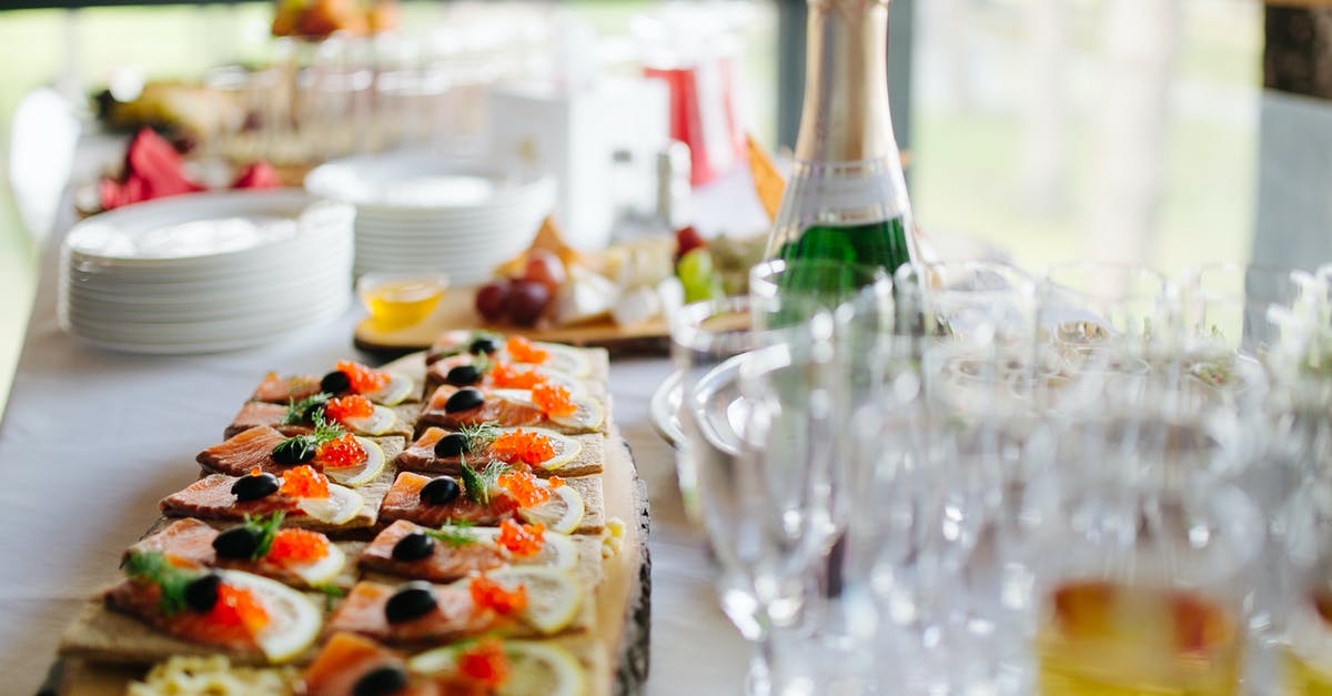 What happens to my boarding party if the enemy ship surrenders? - Catering Appetizers on Wooden Board Next to Empty Champagne Glasses