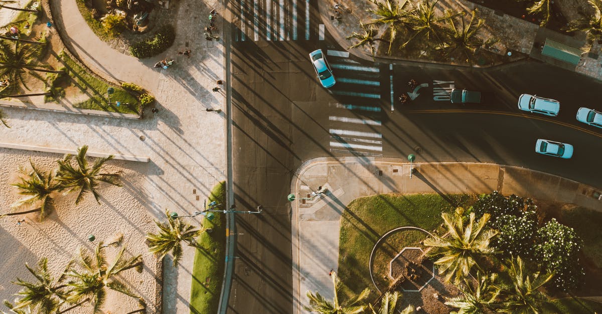 What happens to my turns when I ascend? - Aerial Shot of an Asphalt Road with Turns