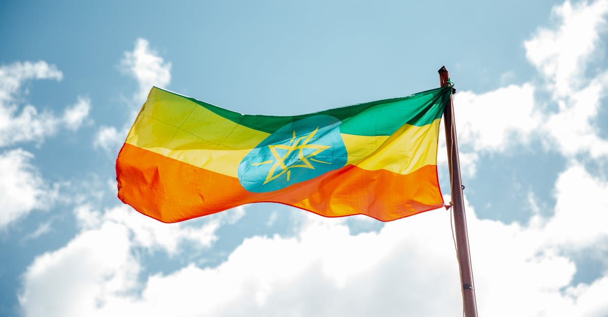 What in-game hints are given for the evolution of Feebas? - National colorful flag of Ethiopia under cloudy sky