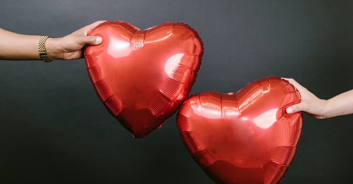 What is Dutch's relationship to Boomer? - Two Persons Holding Two Red Heart Shaped Balloons