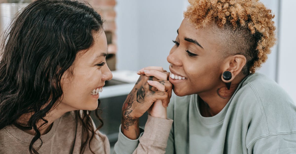 What is Dutch's relationship to Boomer? - Loving lesbian couple admiring each other