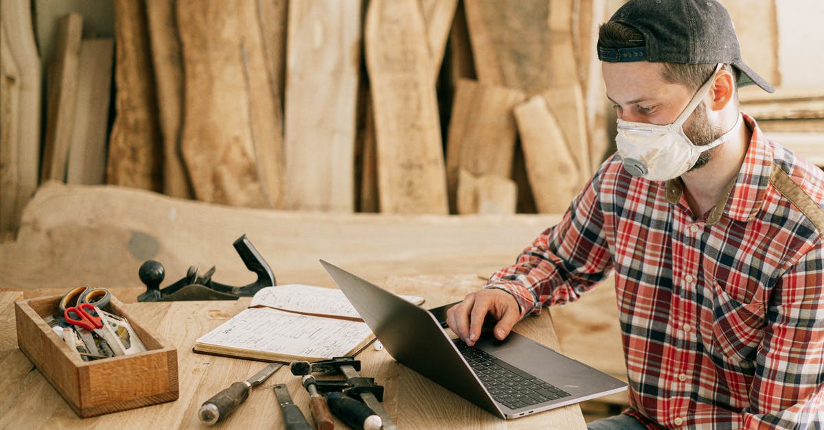 What is missing from Mario Maker for 3DS? - Man Using a Laptop at a Wood Workshop