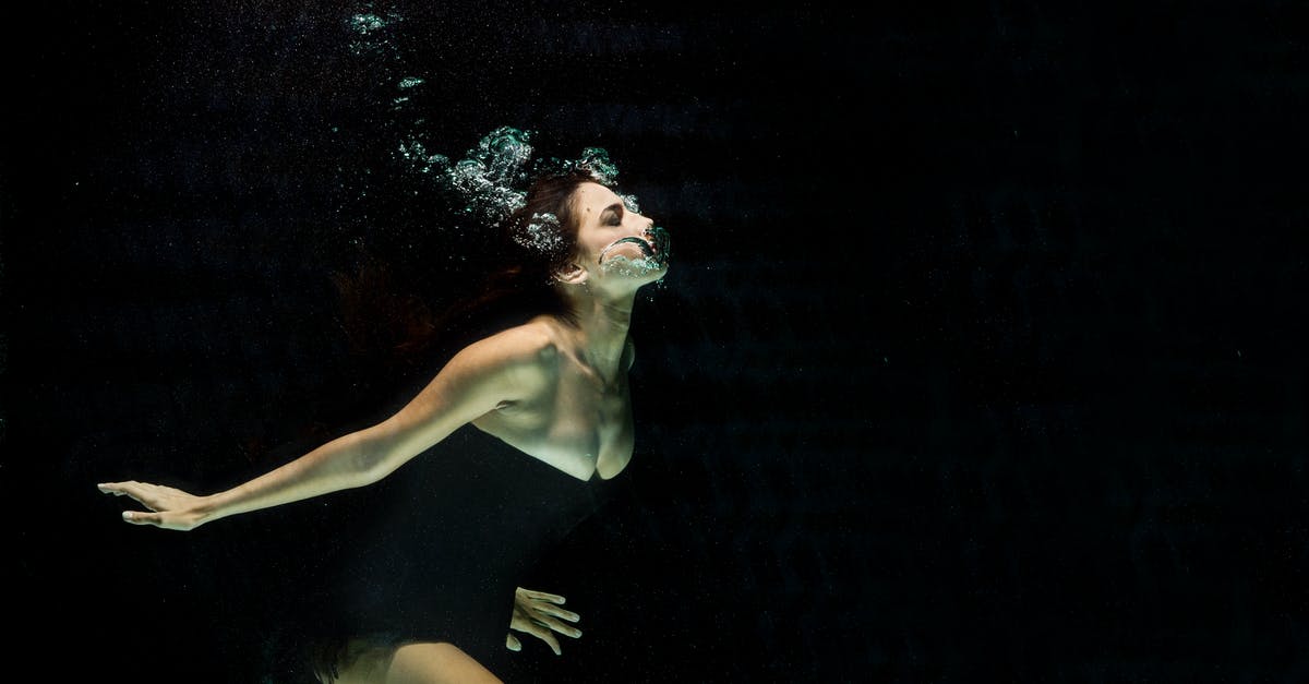 What is the benefit of storing water in tank? - Woman Wearing Black Dress Under Water Photography